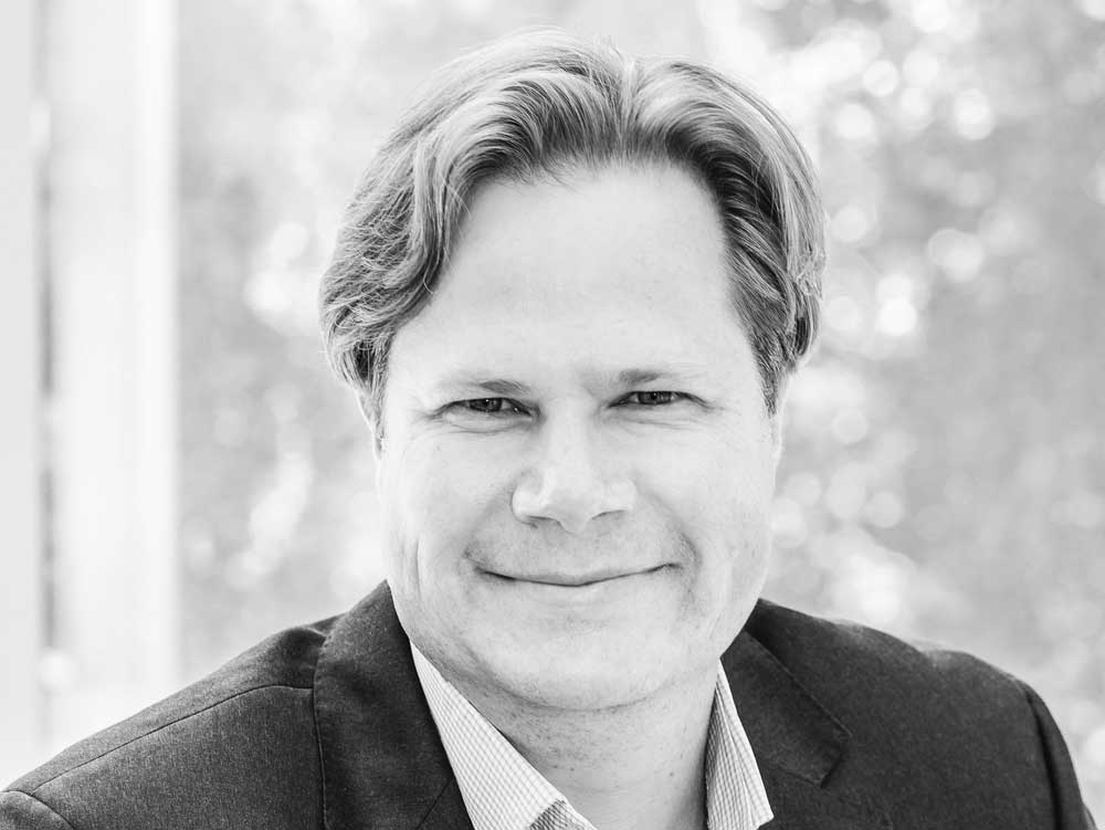 portrait of smiling man wearing suit